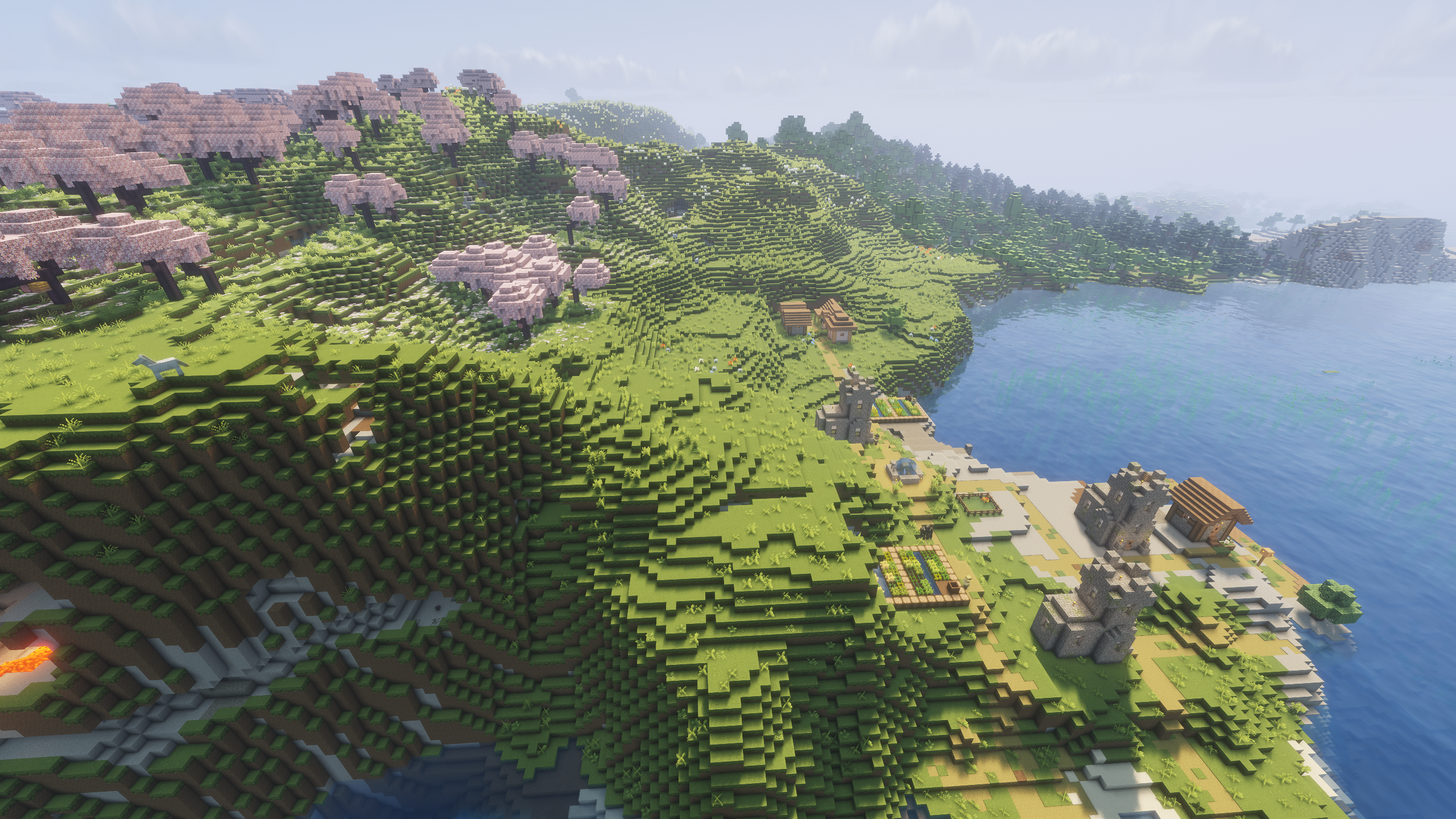 A Minecraft village overlooked by a Cherry Blossom biome